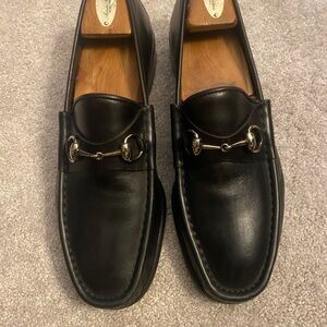 Gucci black leather loafers.